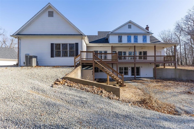 back of house featuring a wooden deck and french doors