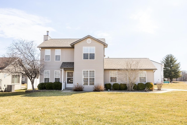 traditional home with a shingled roof, a chimney, central AC unit, and a front lawn