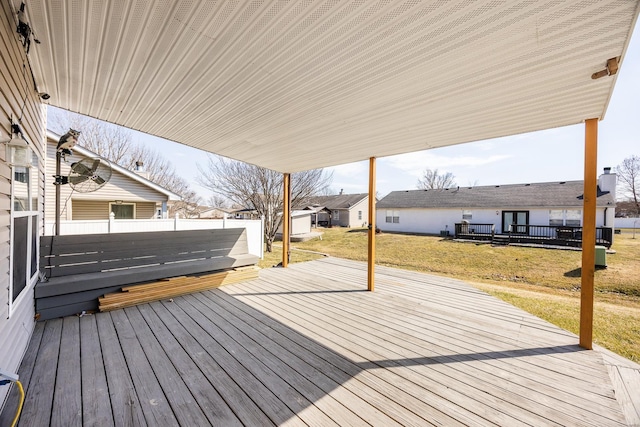 deck featuring a yard and fence