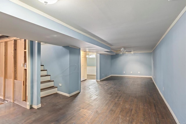 basement with dark wood-type flooring and ornamental molding