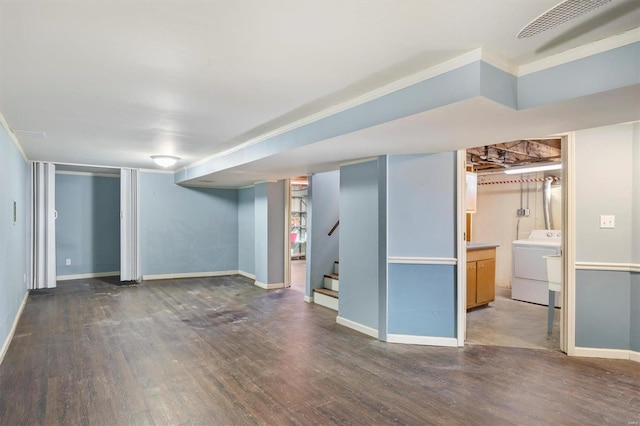 basement featuring washer / clothes dryer and dark hardwood / wood-style floors