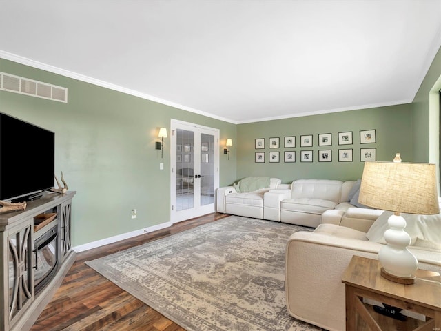 living room featuring french doors, ornamental molding, and dark wood-type flooring