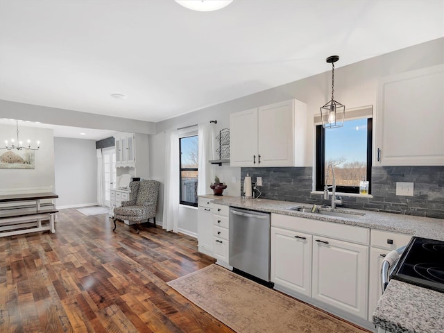 kitchen featuring pendant lighting, stainless steel appliances, dark hardwood / wood-style floors, and white cabinets