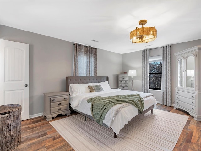 bedroom featuring dark hardwood / wood-style flooring