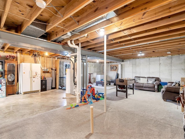 basement featuring white refrigerator