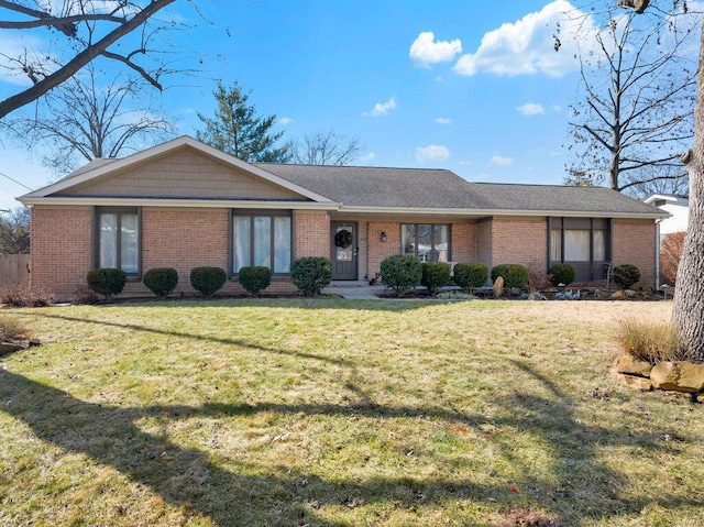 ranch-style home with a front yard