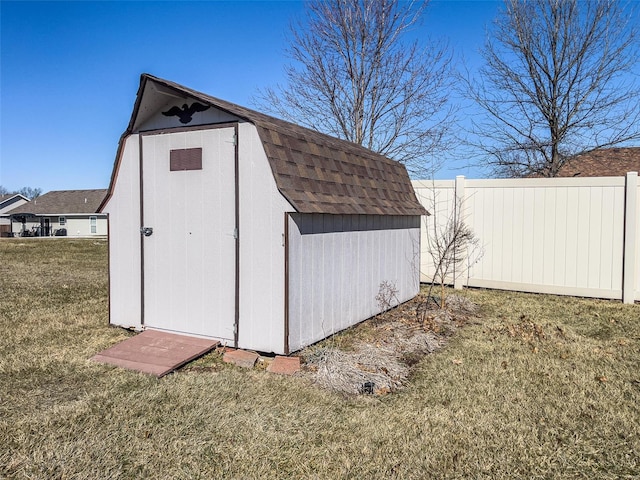 view of outbuilding featuring a yard