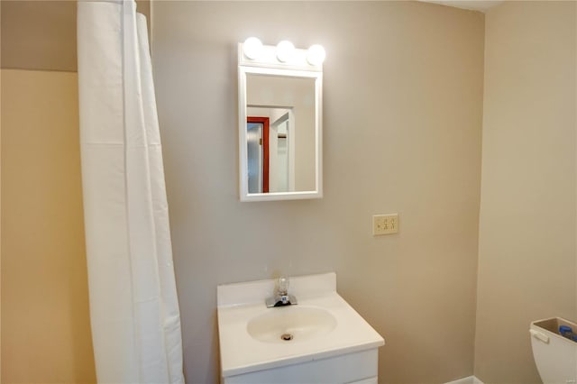 bathroom featuring vanity and toilet