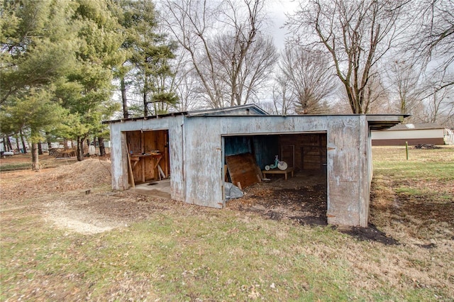 view of outdoor structure featuring a lawn