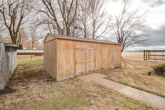 view of outbuilding featuring a lawn