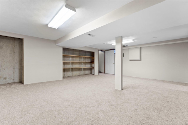 basement with carpet flooring