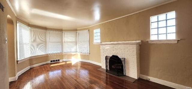 unfurnished living room with crown molding, a fireplace, and dark hardwood / wood-style flooring