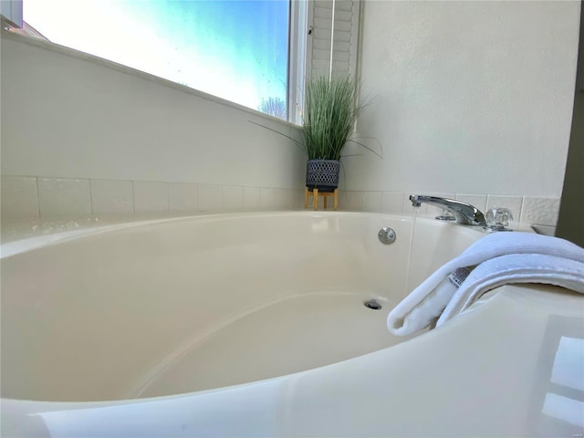 bathroom featuring a tub