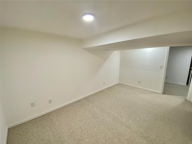 basement with light colored carpet