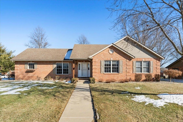 ranch-style home featuring a front lawn