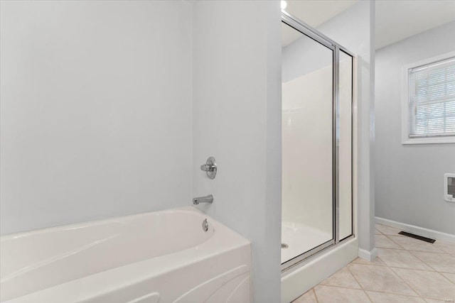 bathroom with tile patterned flooring and plus walk in shower