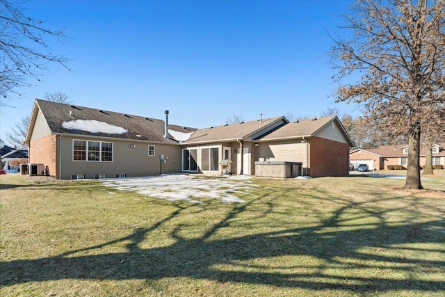 rear view of house featuring central air condition unit, a patio area, and a lawn