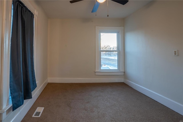 empty room featuring carpet and ceiling fan