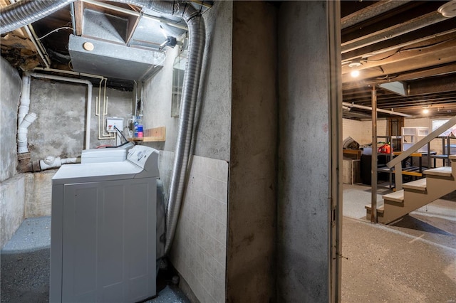 basement featuring washer and clothes dryer