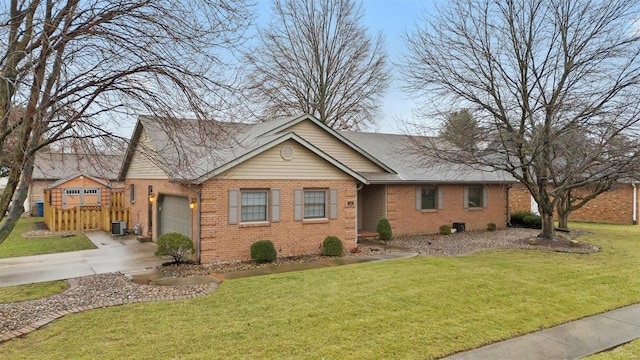 view of front of property featuring central AC unit, a garage, and a front yard