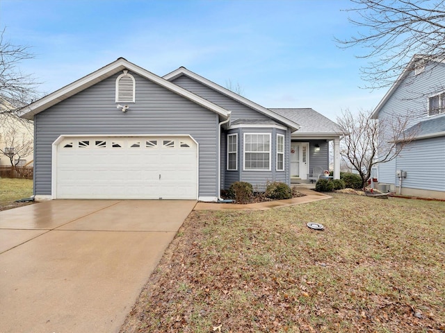 ranch-style home featuring a garage and a front yard