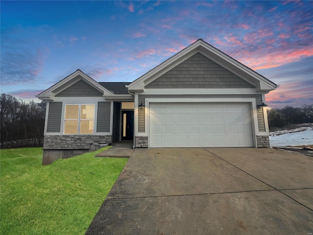 craftsman-style house with a yard and a garage