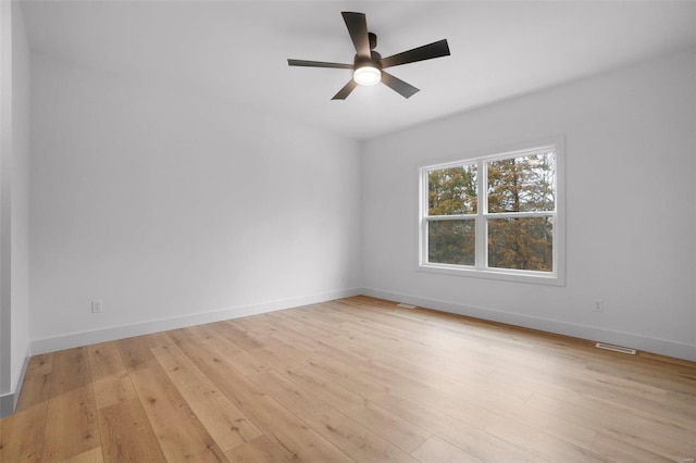 empty room featuring ceiling fan and light wood-type flooring