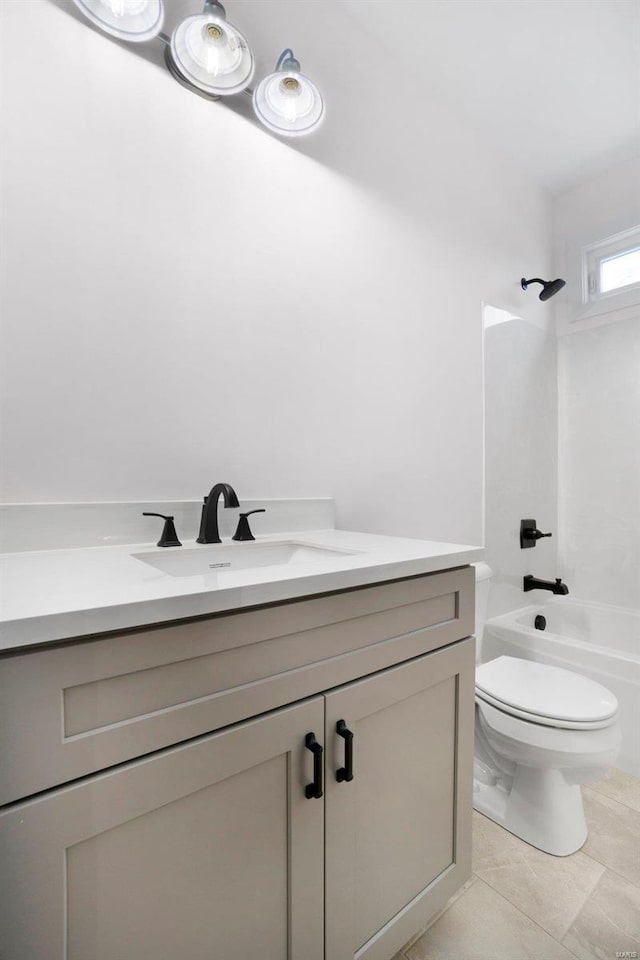 full bathroom featuring vanity, tile patterned flooring, shower / washtub combination, and toilet