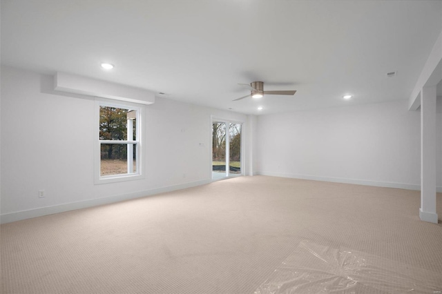 unfurnished room with light carpet and ceiling fan