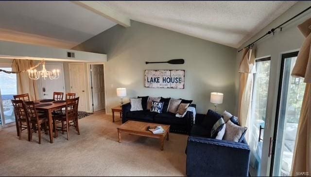 carpeted living room featuring vaulted ceiling with beams and an inviting chandelier