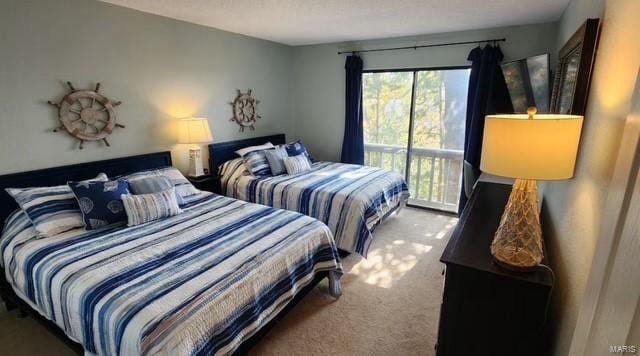 bedroom featuring access to exterior and carpet floors