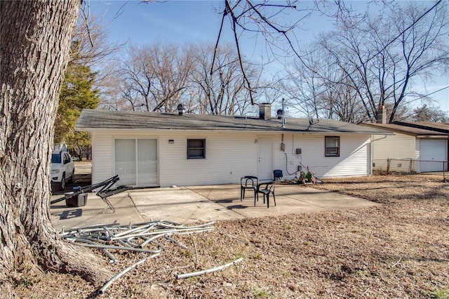 back of house with a patio