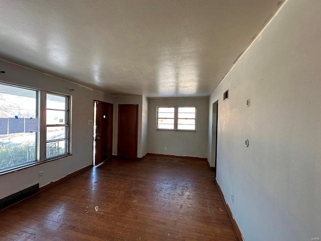 empty room featuring dark hardwood / wood-style floors