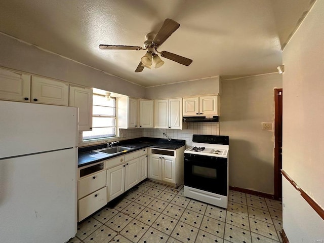 kitchen with sink, white refrigerator, tasteful backsplash, gas stove, and white cabinets