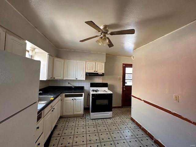 kitchen with range with gas cooktop, white cabinetry, backsplash, white fridge, and ceiling fan