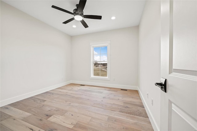 unfurnished room featuring ceiling fan and light hardwood / wood-style floors