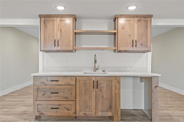 kitchen featuring sink and light wood-type flooring