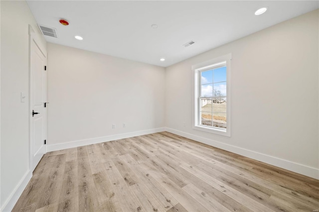 unfurnished room featuring light hardwood / wood-style flooring