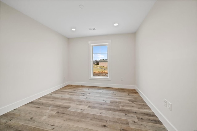 spare room featuring light wood-type flooring