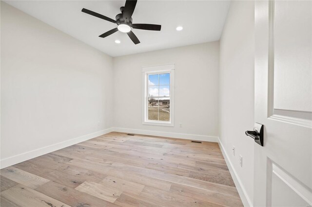 empty room with ceiling fan, light wood finished floors, recessed lighting, and baseboards