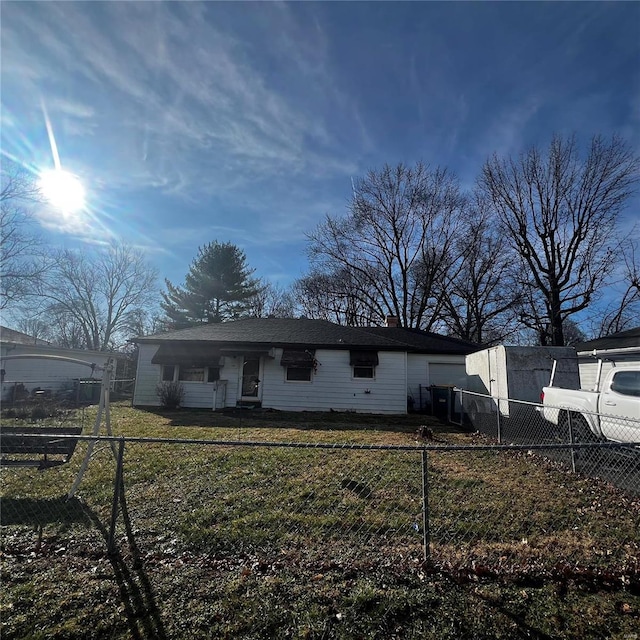 rear view of house with a lawn