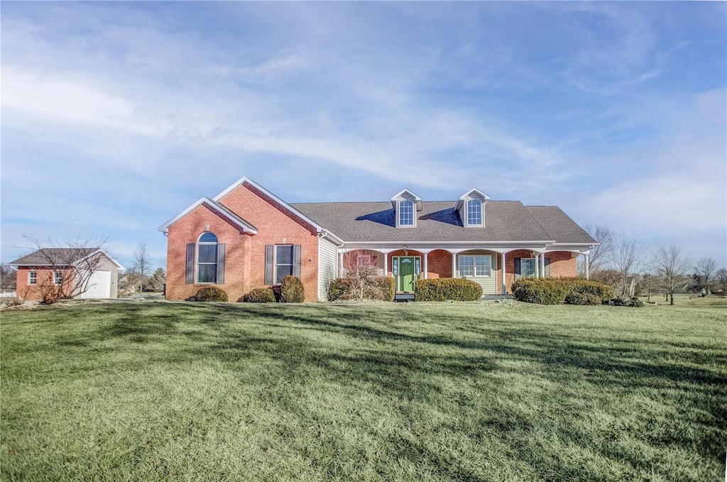 view of front facade with a garage and a front lawn