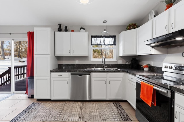 kitchen with stainless steel appliances, white cabinetry, sink, and pendant lighting