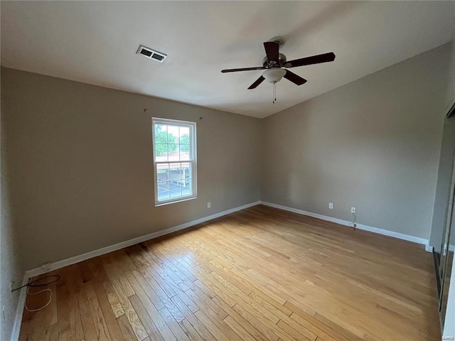 spare room with ceiling fan and light hardwood / wood-style floors