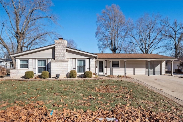 ranch-style house with a carport and a front lawn