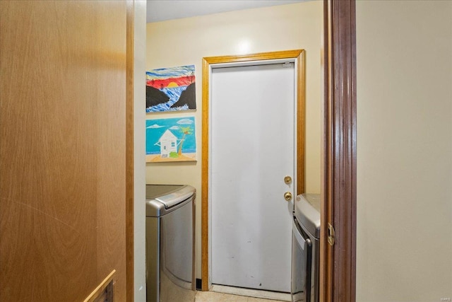 washroom with independent washer and dryer