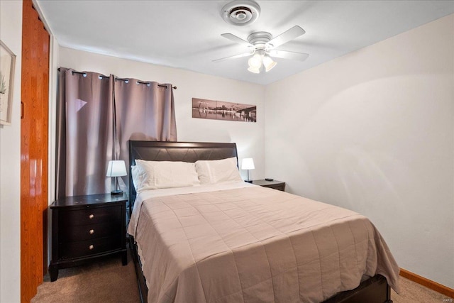 bedroom featuring ceiling fan and dark carpet