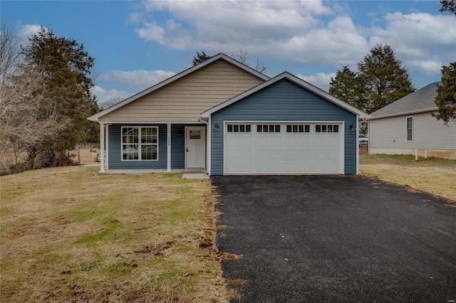 view of front facade with a garage and a front lawn