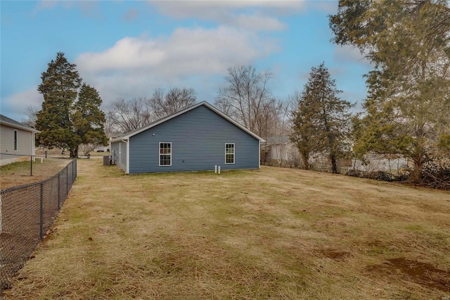 view of side of home featuring a yard