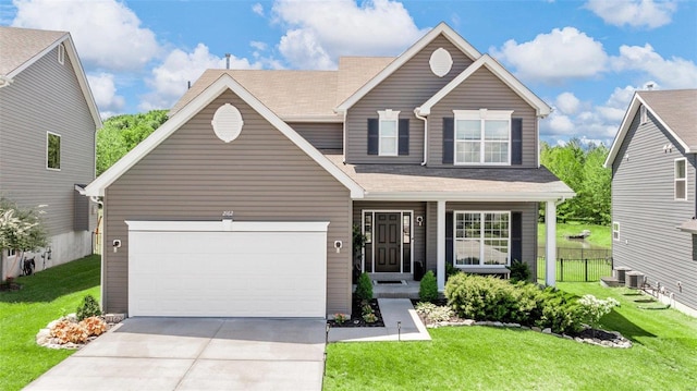 view of front of house featuring a garage and a front lawn